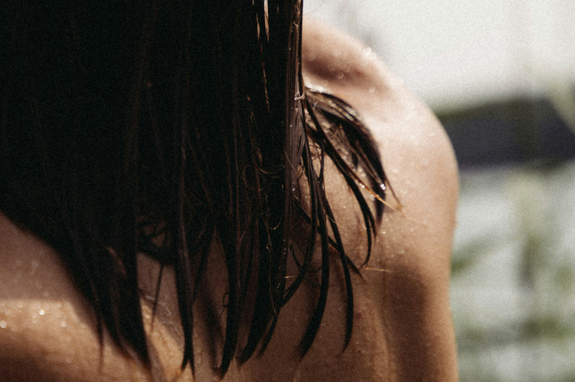 woman in a pool in the sun